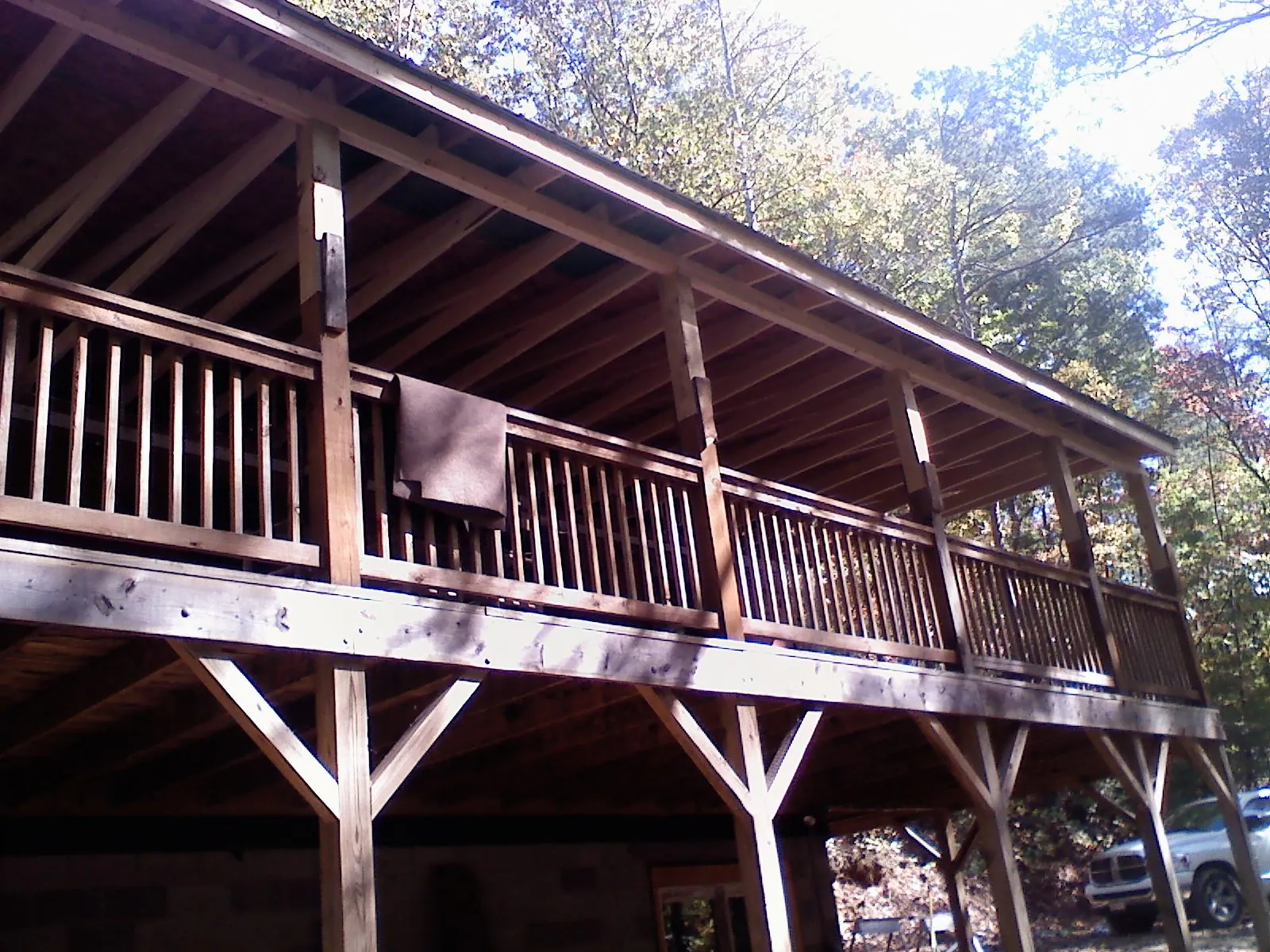 Timber framing under a new elevated porch and deck — Roof Leak Repair in River Falls by Roofing Brothers